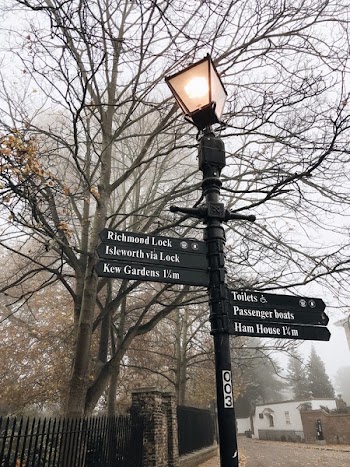 Lighted Black Cast Iron Post Lamp With Direction Signs