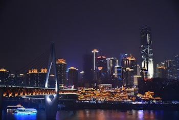 Lighted Buildings Near River at Night