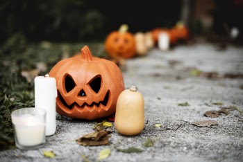 Lighted Candle Near Jack-o'-lantern