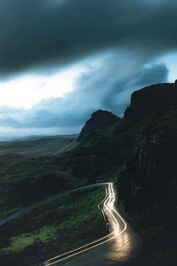 Lighted Car in Winding Road