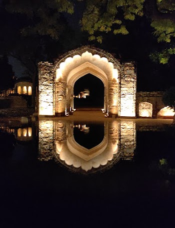 Lighted Concrete Arch at Night