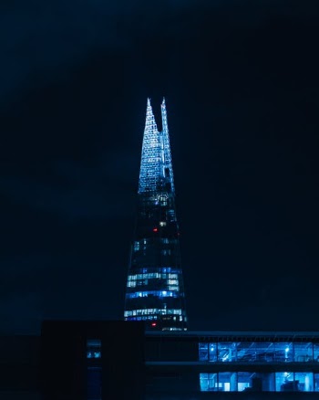 Lighted High Rise Building during Night Time · Free Stock Photo
