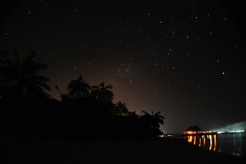 lighted house in island during nighttime
