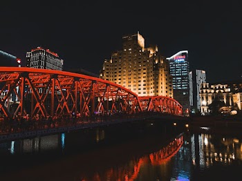 Lighted Red Bridge During Nighttime