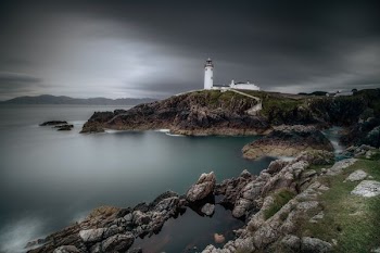 lighthouse on top of hill