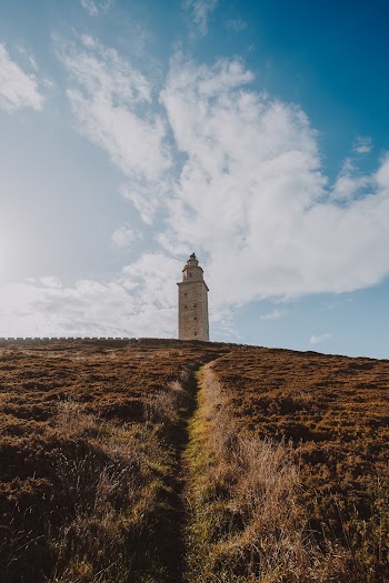 Lighthouse Under Blue Skies