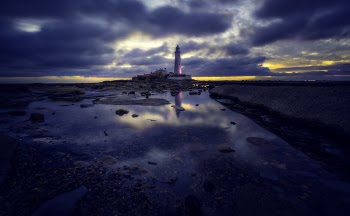 Lighthouse Under Gray Clouds