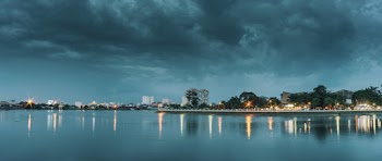 lights reflecting on boby of water