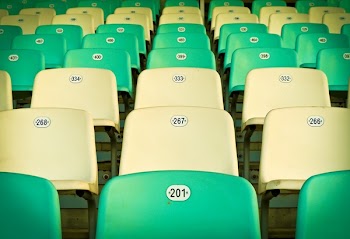 Lined Up Yellow and Green Polypropylene Chairs
