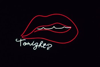 Lips Line Drawing With Tonight Text Overlay on Black Background