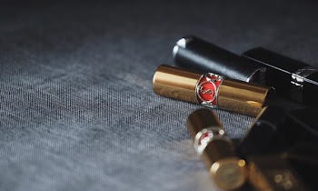 lipsticks on gray panel