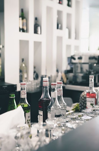 Liqueur syrup bottles on bar | Free Photo - rawpixel