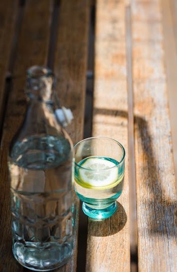 liquor in rock glass and bottle