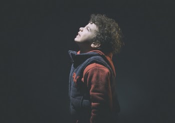 Little Boy Wearing Black And Red Jacket