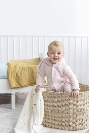 Little girl climbing in a laundry | Free Photo - rawpixel