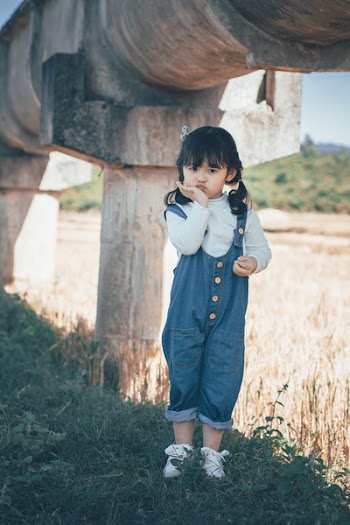 Little Girl In Dungarees