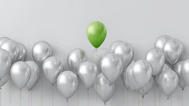 Lone Green Balloon Among Silver Balloons - Birthday Celebration Lone Green Balloon Among Silver Balloons - Birthday Celebration