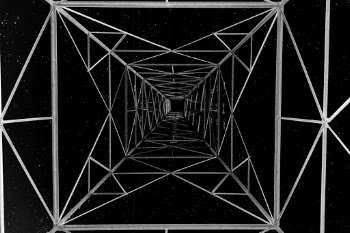 Long exposure of an electrical tower taken at night. I used a flash to light up the electrical tower. The sky was exposed for 20 sec.