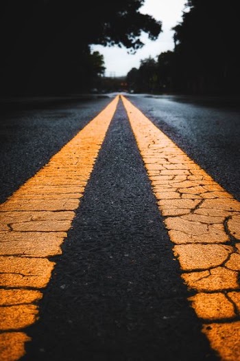 long exposure photo of yellow lines on road