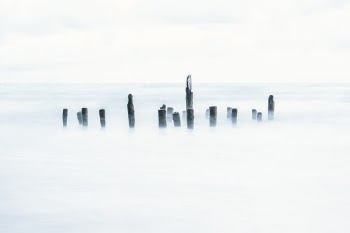 Long exposure shot of an old pier, or what's left of it.