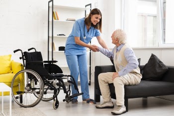 Long shot nurse helping old man getting up Free Photo