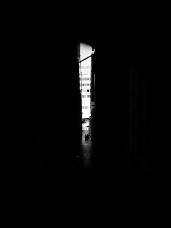 Long Shot Photography Of Two People In An Alley