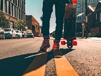 Longboarder On Urban Street