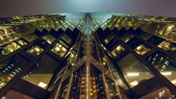 Looking Up at a Skyscraper at Night