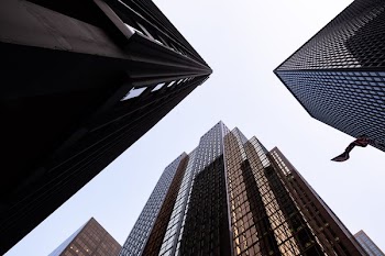 Looking Up At Three Buildings