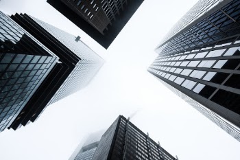 Looking up to Frankfurt's skyscrapers during a foggy morning. 