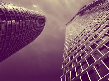 Low Angle and Sepia Toned Photography of Two High Rise Buildings
