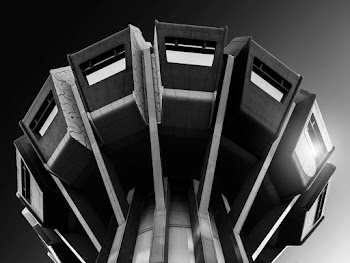 Low-angle Grayscale Photography of a Tower