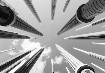 low-angle grayscale photography of high-rise building