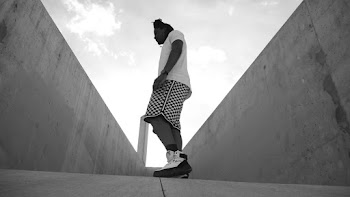 Low Angle Grayscale Side View Photo of Man Posing