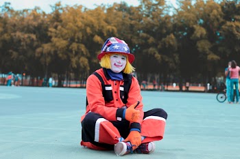 Low-angle of Clown Sitting on Ground