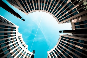 Low Angle Photo 0f Blue Sky Between Circular Structure