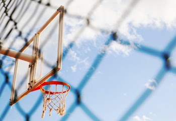 Low-Angle Photo of Basketball Hoop Under Blue Sky