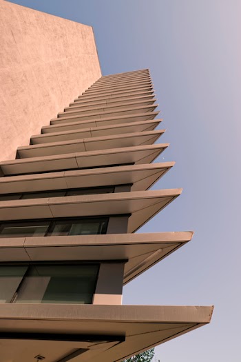 Low Angle Photo of Beige High Rise Building
