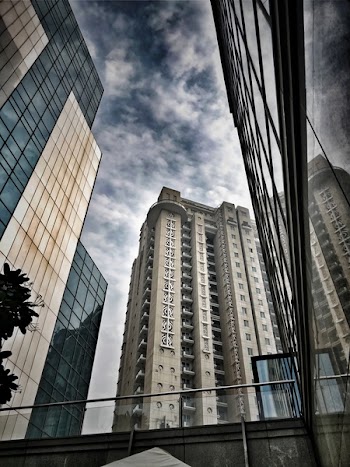Low-angle Photo of Brown and Gray Concrete Building