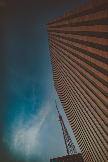 Low Angle Photo of Brown Concrete Building Under Clear Sky