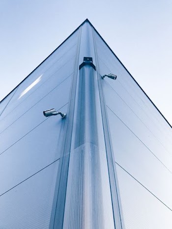 low-angle photo of building with security cameras