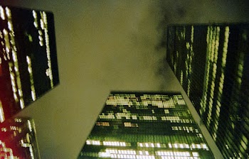 Low Angle Photo of Buildings Under Cloudy Sky