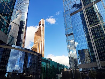 Low Angle Photo of Commercial Glass Buildings Under Clear Sky