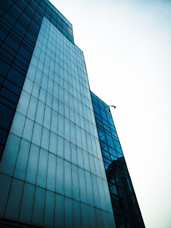 Low Angle Photo of Curtain Glass Wall Building