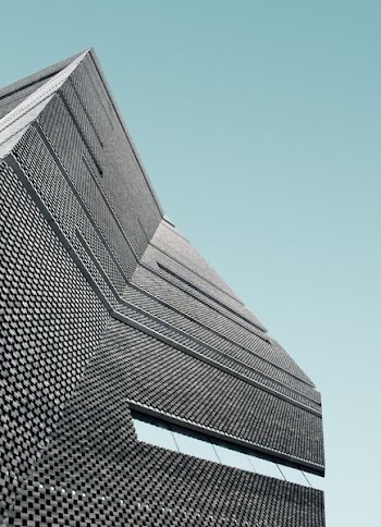 low angle photo of curtain wall building