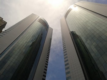 Low Angle Photo of Curtain Window Buildings