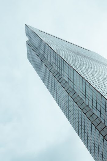 low angle photo of curtain window high rise building