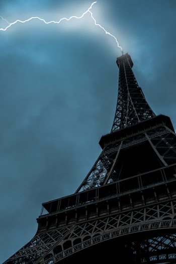 Low-angle Photo of Eiffel Tower Struck by Lightning