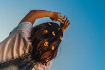 Low Angle Photo of Girl With Flowers On Her Hair