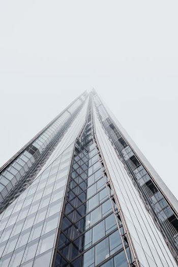 low-angle photo of glass building